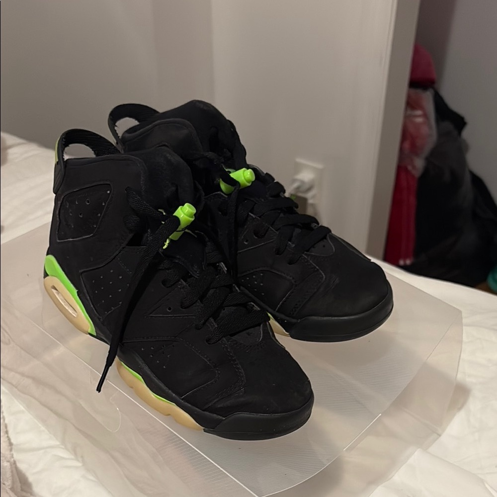 Kids black and green glow in the dark jordan 6s